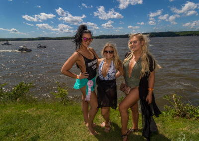 girls posing lake front